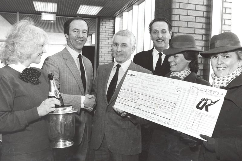 Pictured are, from left, Frances Butler, airport information assistant; Roy Minear, assistant director of the airport; Mr Joice; Tony Birth, airport terminal manager and Tricia James and Ellie Rooner of Air UK. Pictured in January 1986.