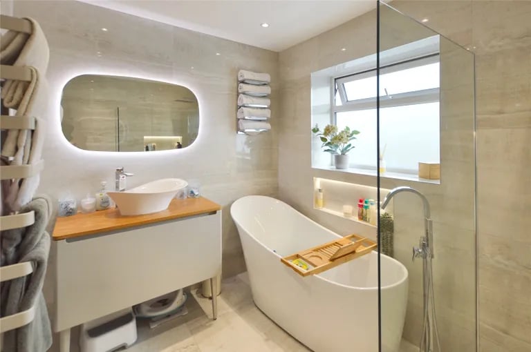 The luxurious house bathroom features a stylish bathtub and separate shower.