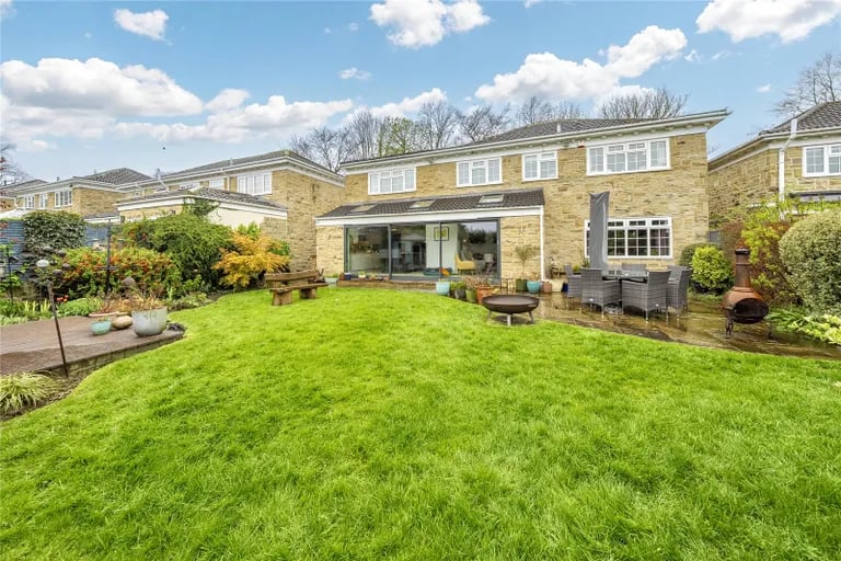 Externally is a large green garden with an extensive lawn.