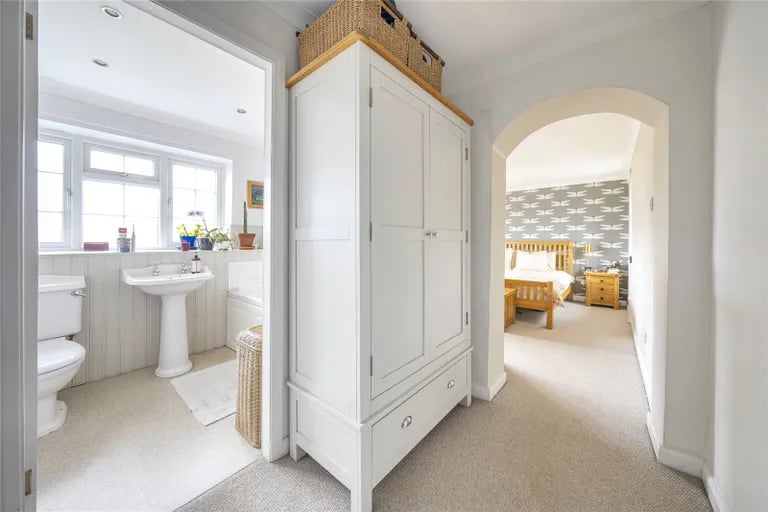 A landing gives access to the first floor rooms.