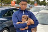 Burham Ali with Sniper as a puppy. Burham is clinging to hopes his XL Bully is still alive, amid reports he was destroyed after an armed police raid on a house in Sheffield. Picture: Burham Ali