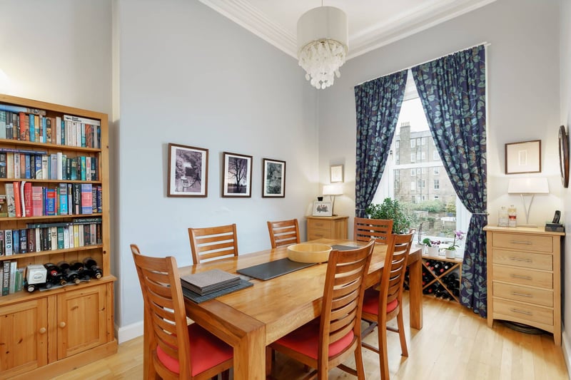 A dining room adjoins the kitchen and the original dividing wall has been partially removed to create an open plan layout that is excellent for modern family life and entertaining. 