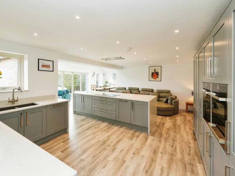 The kitchen is modern and features lots of storage space, two ovens and a lovely kitchen island.