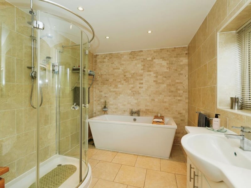 The en-suite is fully equipped with a shower, toilet, sink and bath,.