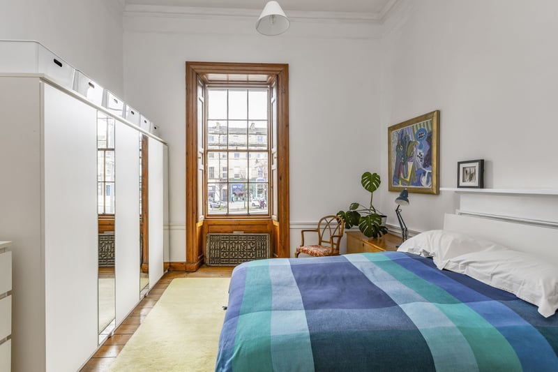Attractive wooden flooring adds warmth and character to each bedroom, while large windows frame picturesque views of the surrounding neighbourhood.