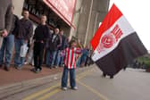 Sophie Wood (6) waves her Blades flag as she queues for her FA Cup semi-final tickets at Bramall Lane in March 2003