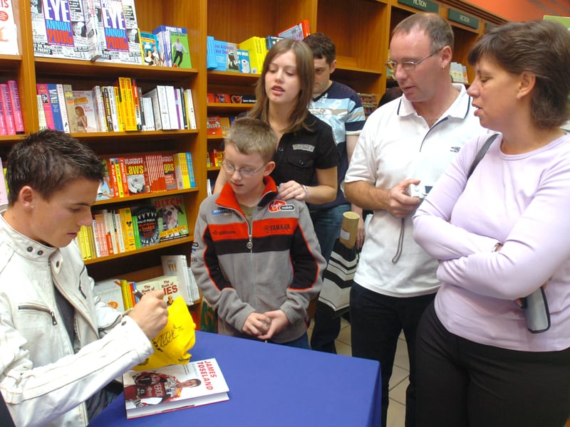 James Toseland signs books at Ottakar's Book Shop, in Meadowhall, where nine-year-old Tom Hinde was first in the queue