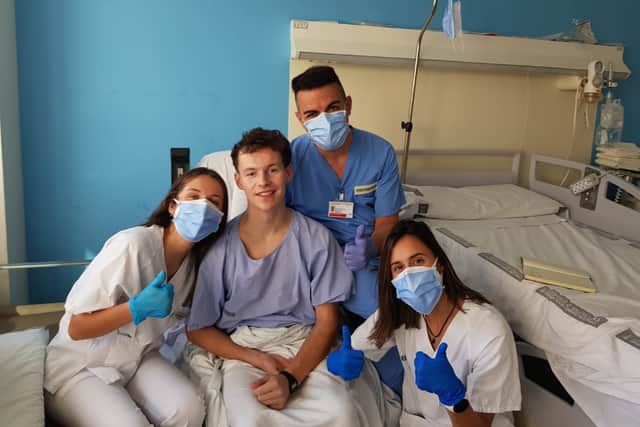 Connor with hospital staff in Spain after he woke from his coma in 2020. 