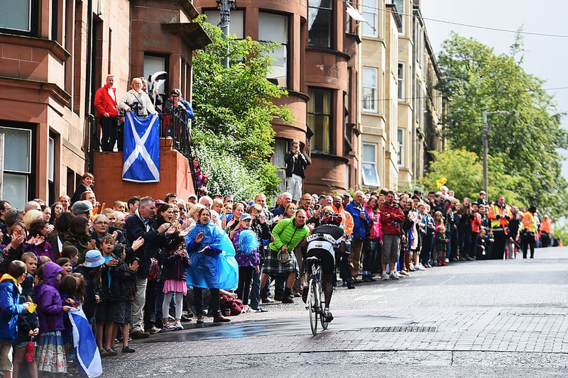 Sebastian Kigongo Semakula of Uganda is cheered on by spectators in the Men's Road Race during day eleven of the Glasgow 2014 Commonwealth Games on August 3, 2014.