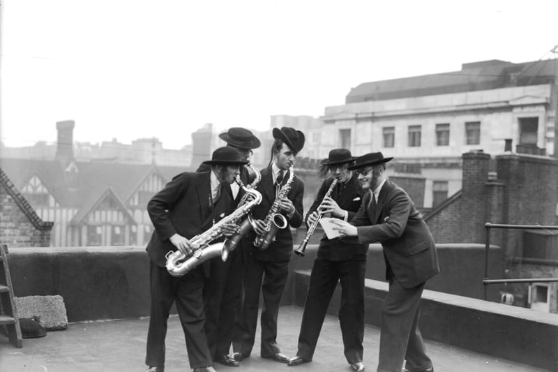 Dressed in traditional Jewish garb, Mackay's Dance Band perform on the roof of the Palladium, London.   (Photo by General Photographic Agency/Getty Images)