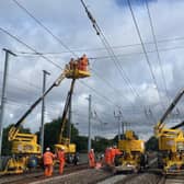 Engineers installing overhead lines as part of the Midland Mainline upgrade.