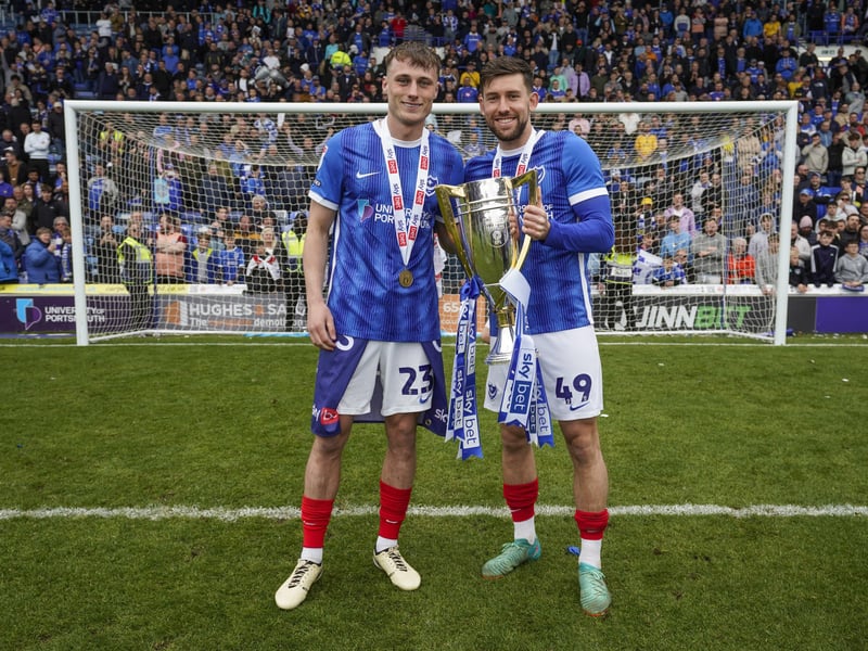 Owen Moxon and Callum Lang savour the moment in front of the Fratton End