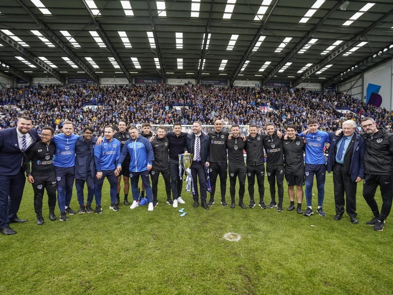 John Mousinho and sporting director Rich Hughes with the backroom staff behind Pompey's success this season