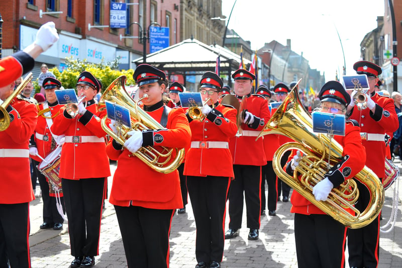 The West Yorkshire Fire and Rescue Service band lead the parade through Morley.