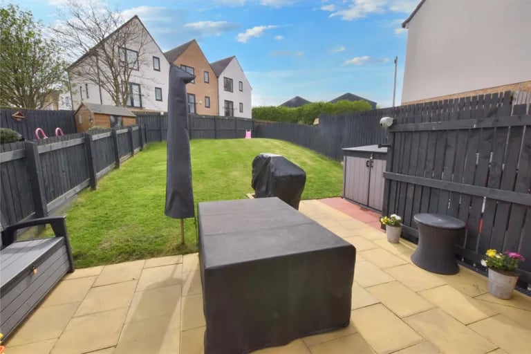 The enclosed rear garden is offers a tranquil outdoor space.