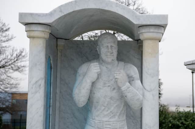 One of the life-size statues of Willy Collins at his grave in Shiregreen Cemetery, Sheffield