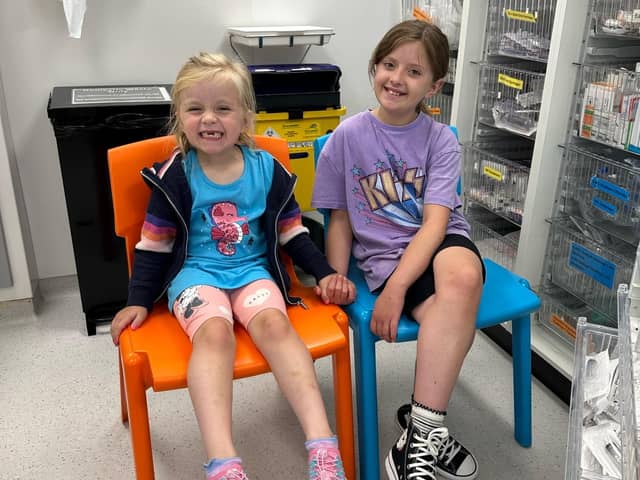 Mabel and Ruby Leaning at Sheffield Children's Hospital. Ruby was diagnosed with a rare blood cancer which is now in remission thanks to her little sister's lifesaving bone marrow donation.