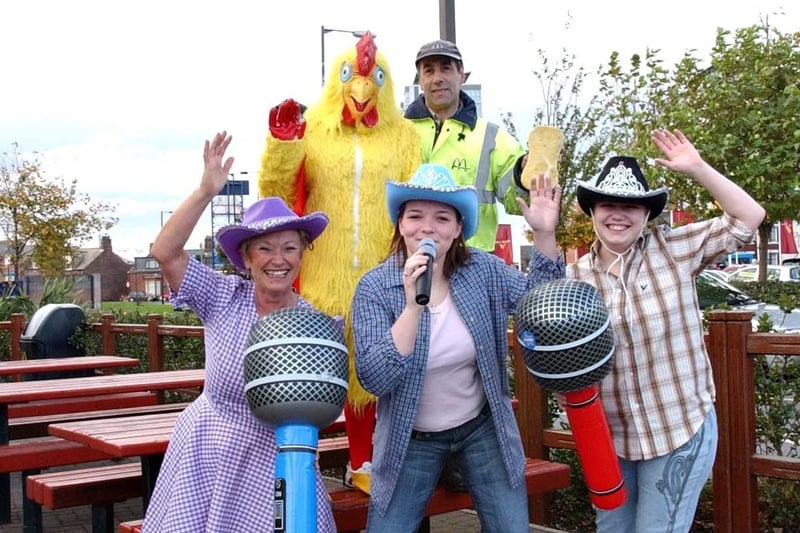 All dressed up for a charity day were back; Karen Foxton as a chicken and Luciano Fella as a car washer.
In the front are Lyndsey Day doing the singing with support from Cath O'Leary, left, and Stacey Rushworth.