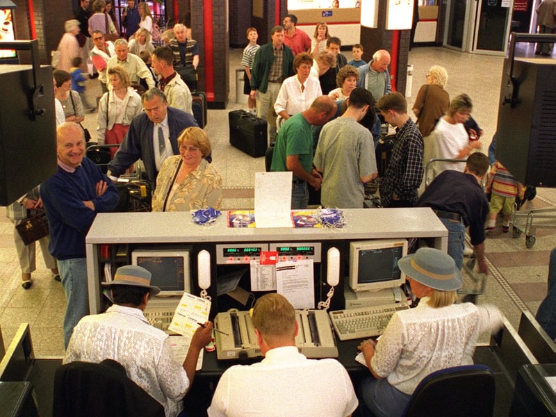 Leaving on a jet plane. Holidaymakers check-in for a flight to Palma in June 1996.