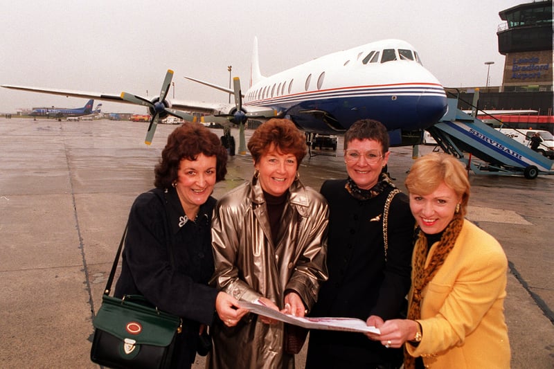 The Vickers Viscount 806X G-APEY stands on the tarmac  after its last UK flight in November 1997 before heading abroad. On board were four air stewardesses  who worked on the aircraft from Leeds Bradford in the 1970s. They are, from left, Carol Clark, Wendy Storey, Julie McIntyre and Jill Helm  with a brochure of the aircraft.