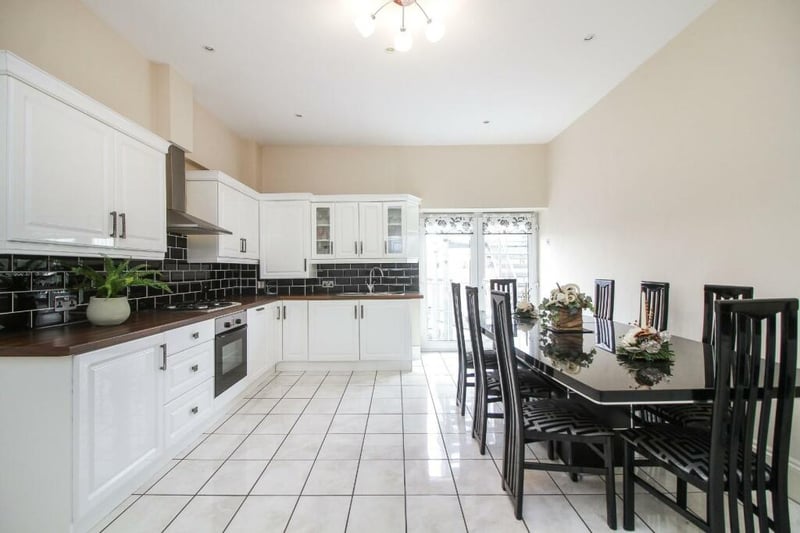 The kitchen is well presented with a number of integrated appliances and enough space to host family and friends for dinner parties.