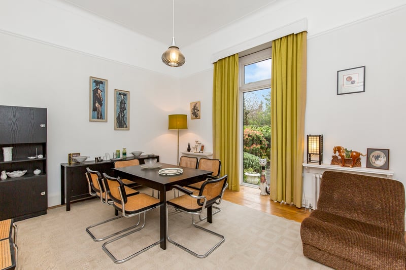 The third bedroom showcases the versatility of the property. Decorated in neutral hues and brightly illuminated by an oversized window, this bedroom is currently organised as a formal dining room for special occasions.