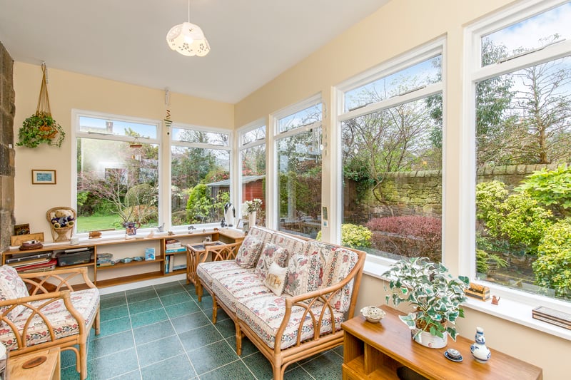 The  sun room, which has triple-aspect windows and a southerly-facing aspect – absorbing lots of natural light and the serene garden ambience.