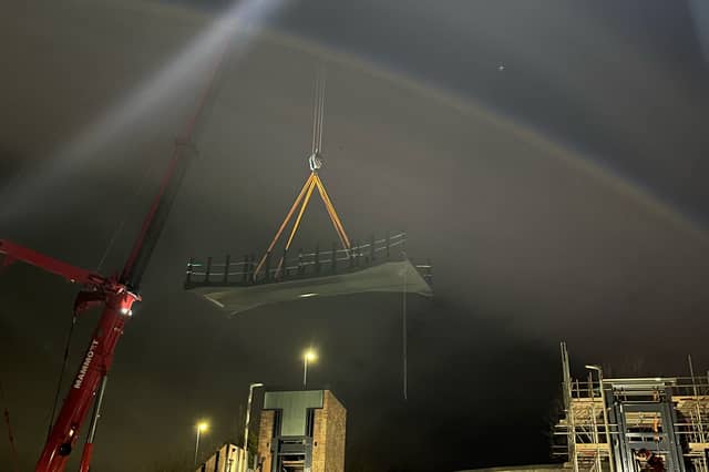 Part of the Garforth bridge deck being craned into place over the weekend.