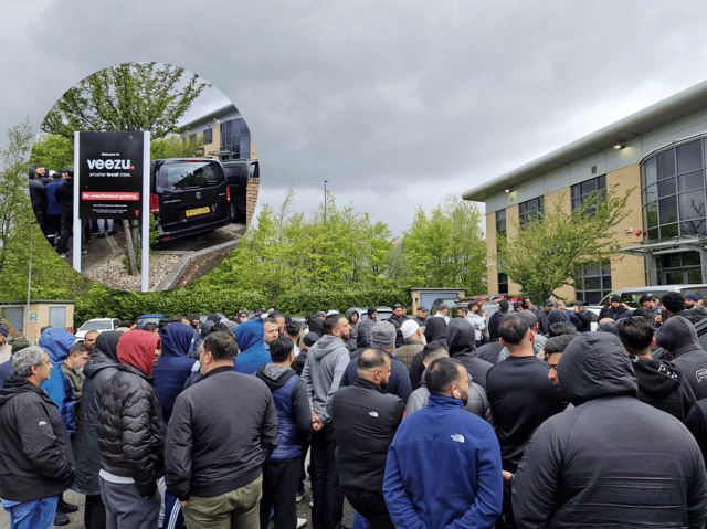Veezu drivers gather outside the company's Sheffield offices. They were protesting against the "staggering" cut the app is taking from taxi fares.