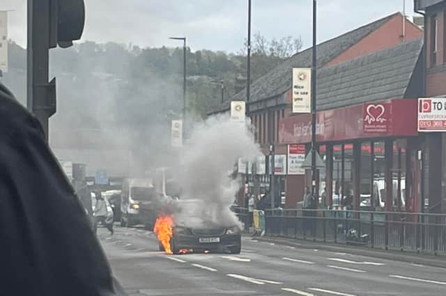 Car ablaze in Sheffield as firefighters close major road