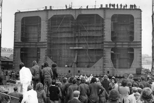 Workers watch as the after section of the 112,000 ton Bibby Line tanker Yorkshire is launched. It would later go to Hebburn Shipbuilding Dock to be joined to the forepart which was being built there