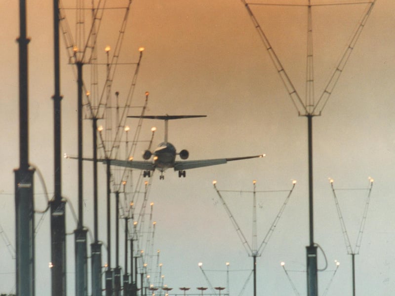Safe landing. A jet makes a dusk approach in June 1993.