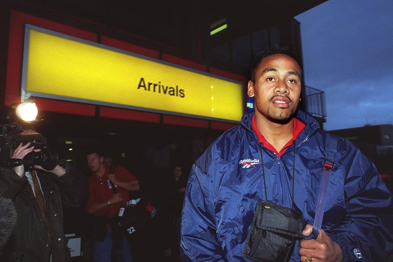New Zealand All Black rugby winger Jonah Lumo makes his way through arrivals in November 1996.
