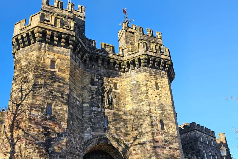 Lancaster Castle looking beautiful against a clear blue sky. 