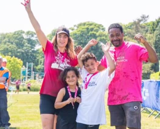 Abi Malcolm with her husband, Shawn, and their kids, Bettie and Stanley at Race for Life 2023.