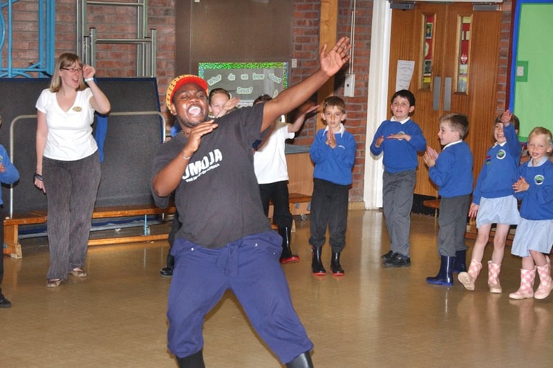 Fanuel Kapumha was teaching the pupils at Holley Park Primary how to do welly dancing in June 2007.