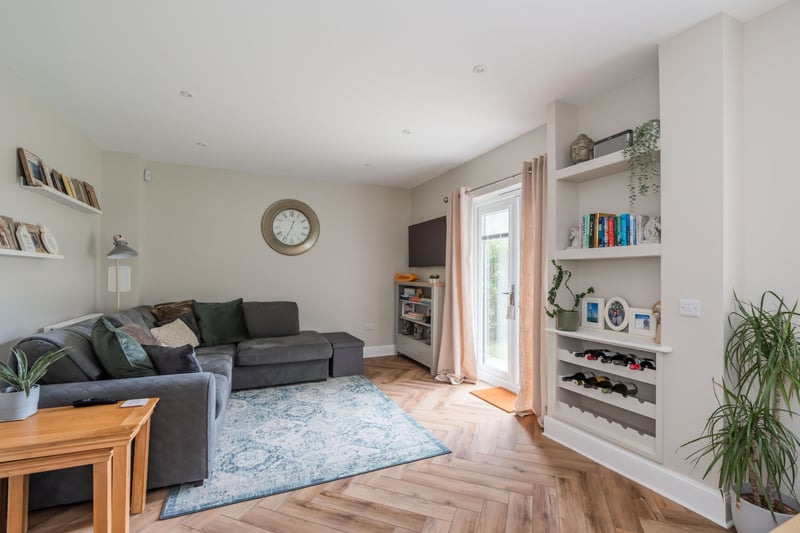 The bright and welcoming family area situated off the kitchen/ dining area, with French doors leading out to the rear garden.