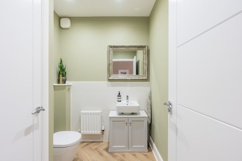 In true move-in condition, the accommodation is well proportioned and laid out over two levels. You enter into a welcoming hallway with a handy downstairs WC with storage cupboard and plumbing to allow a shower to be installed if desired.