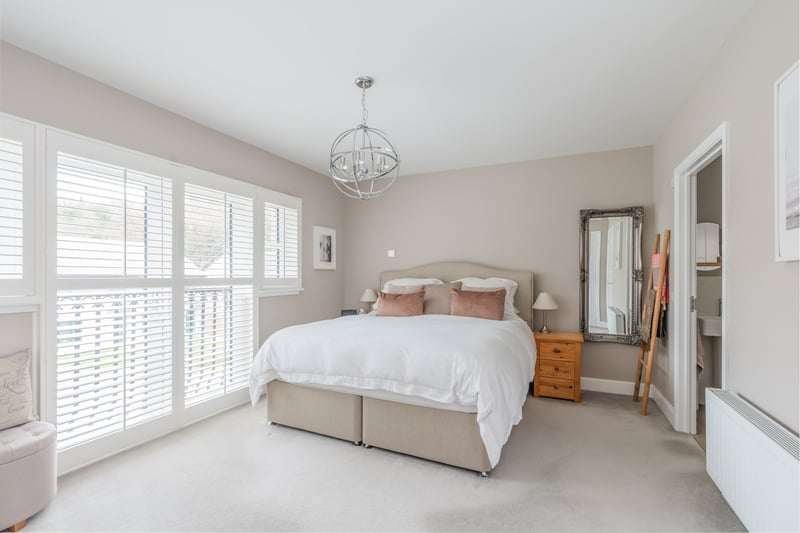  The principal bedroom, which has French doors opening to a Juliette balcony, also has built-in wardrobes and the added benefit of an en-suite shower room.