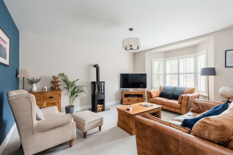 The bright and spacious sitting room overlooks the front garden. Meanwhile, the communal grounds for the street are maintained by Charles White with a quarterly charge of approximately £55.