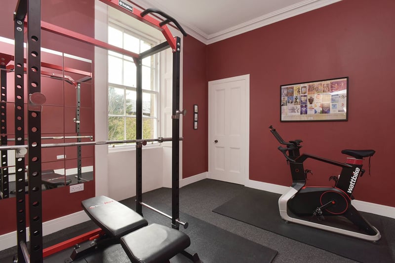 The large Penicuik property's third double bedroom is situated upstairs and is currently used as a gym.