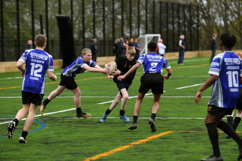 Students from the school's rugby team train on the new pitch.