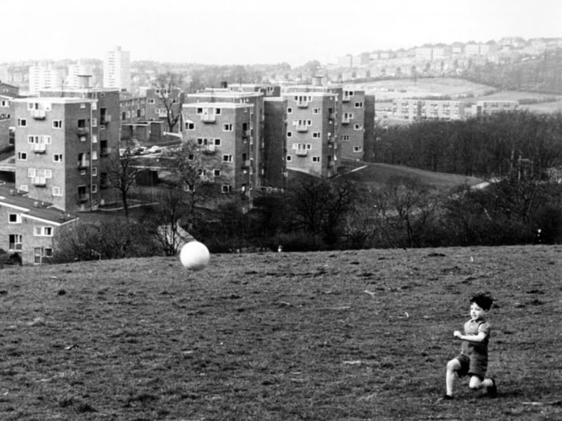A boy playing football on the Gleadless Valley estate, Sheffield, in the 1960s