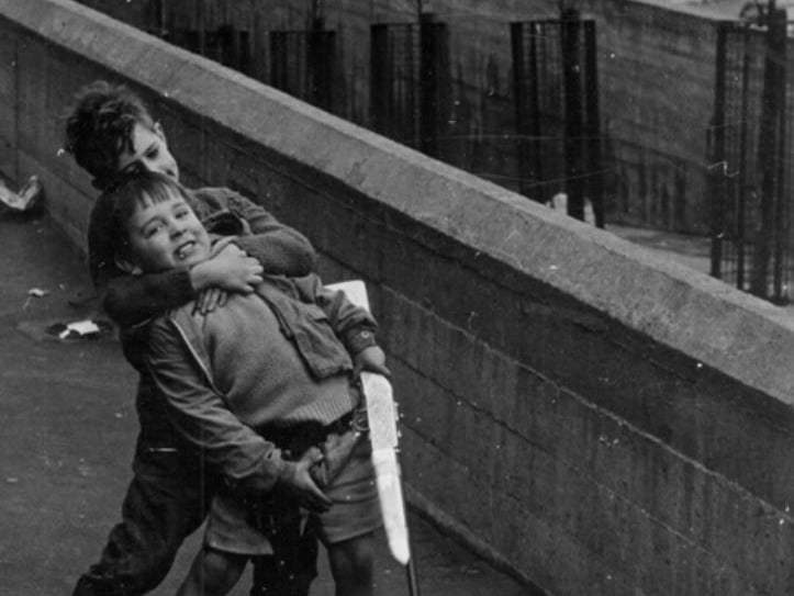 Two boys playing at Park Hill, Sheffield, during the 1960s
