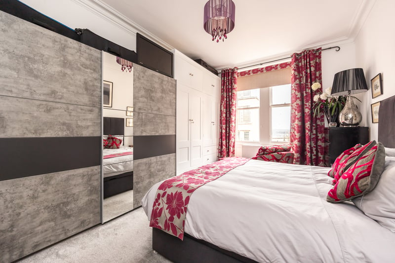 The large front-facing double bedroom is of generous proportions and is fitted with built-in wardrobes. 