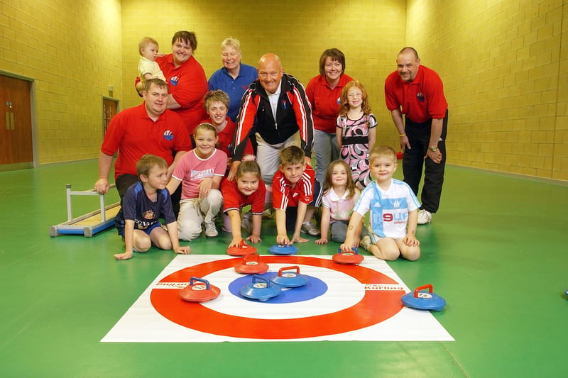 A new curling club was launched at the school in April 2007 and former world champion Neil Rooney, centre, came along to help.