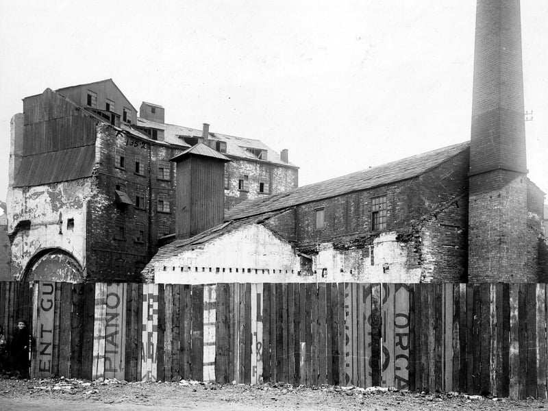 Part of the Swinegate Sovereign Street Improvement area pictured in July 1905. Mill and factory buildings can be seen. Corn mills were numerous in this area, including the historic Kings Mills. The River Aire powered water wheels to grind the corn. Until 1839 Leeds people were obliged to have their corn ground at the Kings Mill. A carved stone is set onto the riverbank to mark the site.