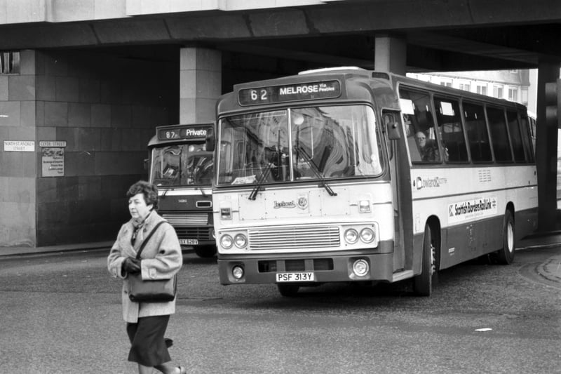 A bus headed for Melrose in the Borders leaves St Andrew Square bus station in Edinburgh, March 1986.
