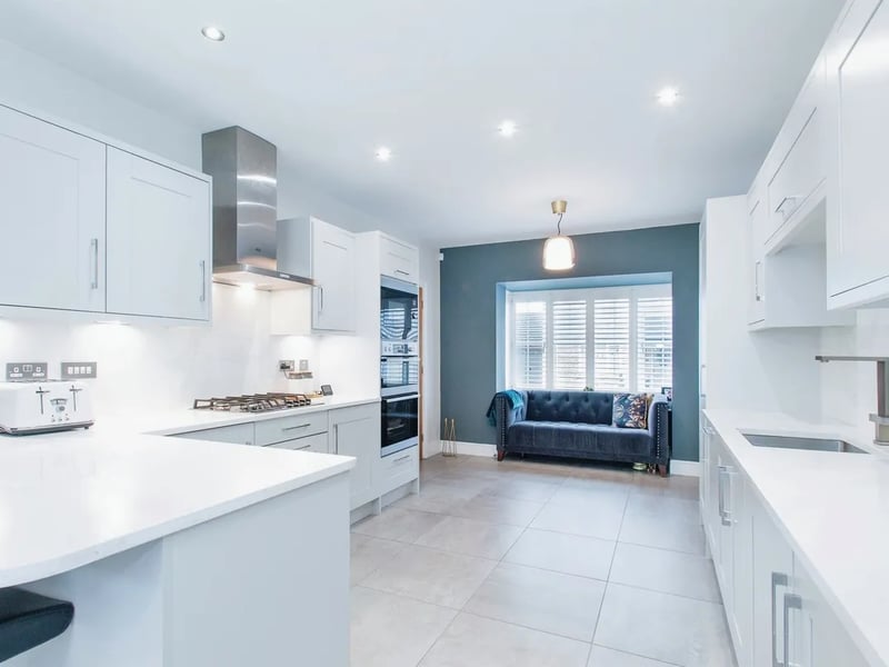 The luxurious fitted kitchen features wall hung, drawer and base units.