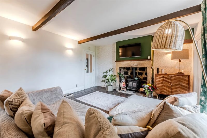 Here you'll find exposed ceiling beams and a cosy log burner.